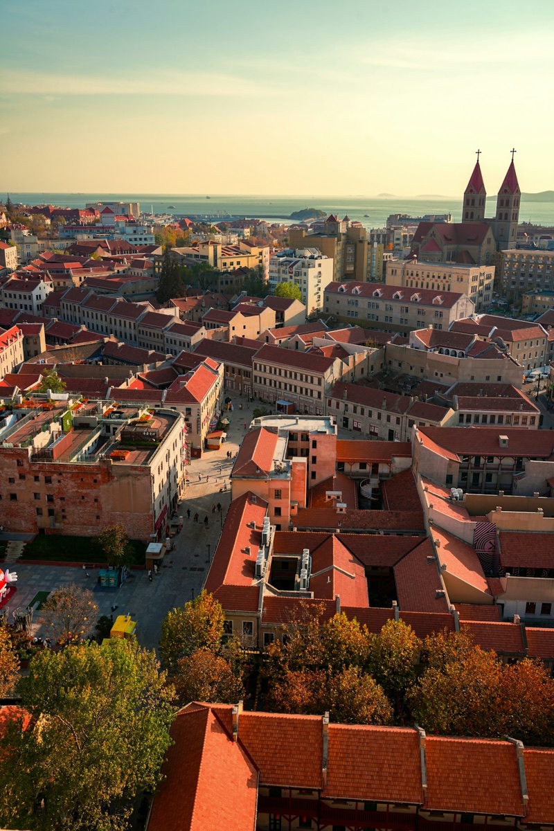 Qingdao’s old town red roofs and cathedral with the sea beyond